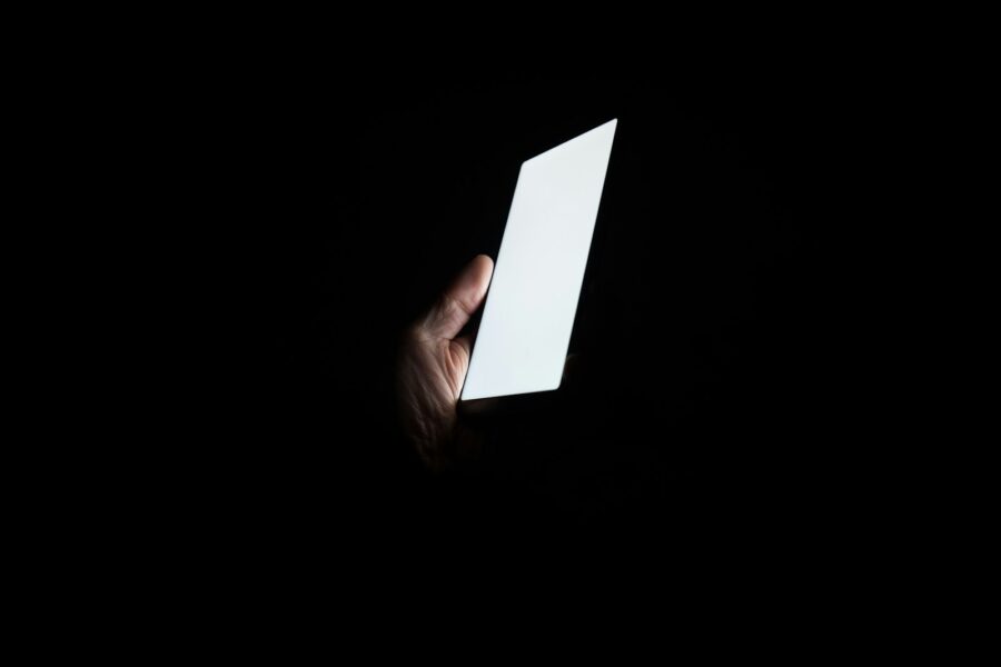 Person laptop smartphone