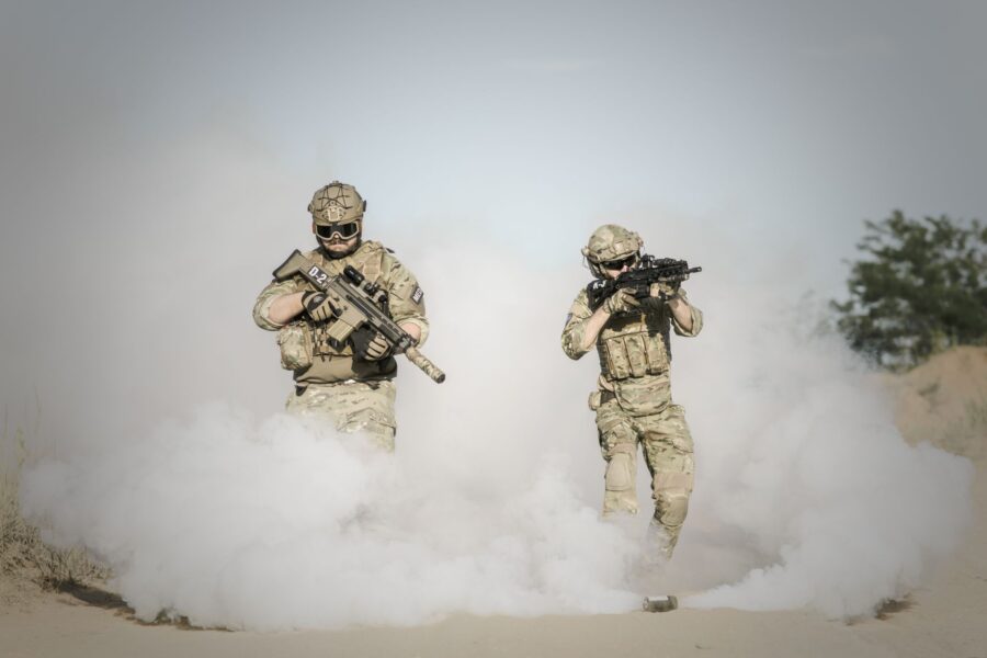 Soldiers walking battlefield